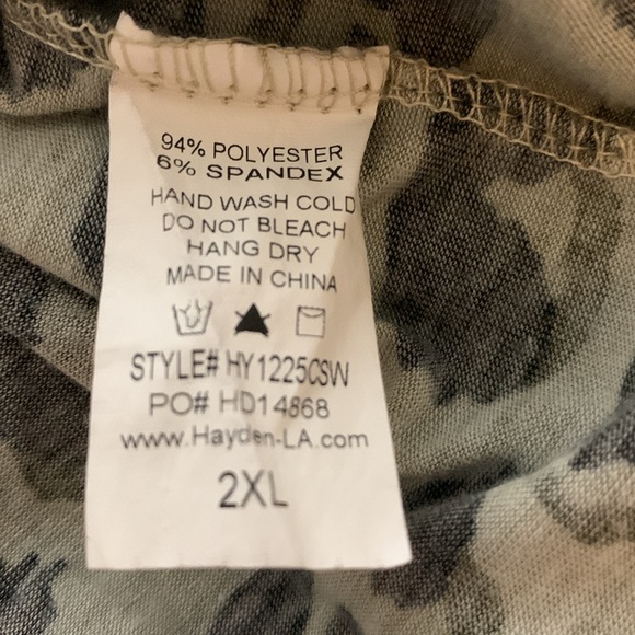 Woman’s long sleeve animal print babydoll top with rounded neckline. - Picture 8 of 8